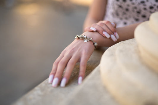 closeup-girl-s-hand-with-beautiful-manicure-jewelry-bracelet-her-hand